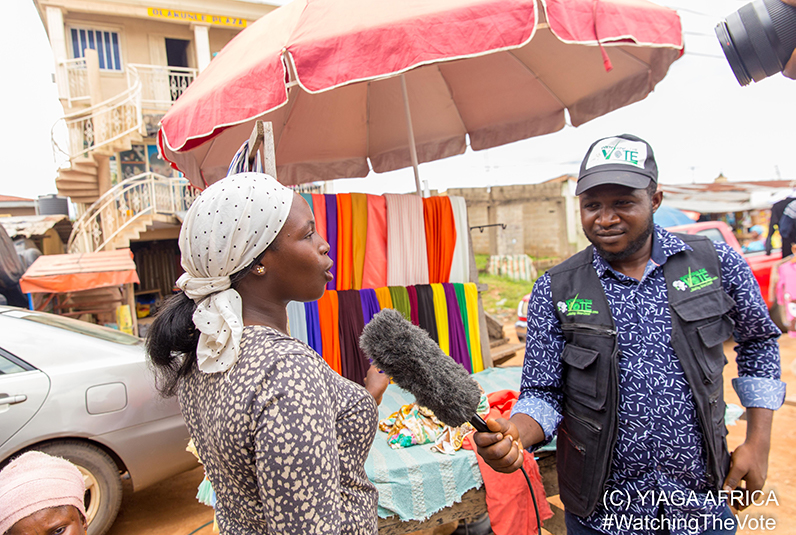 Topline message Representative from YIAGA Africa interviews a woman in the market.